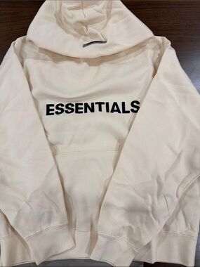 Essentials Men's Cream Hoodie with Black Logo